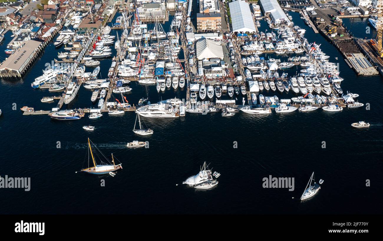 Aerial stock photos of the Newport Harbor, boats docked and moored in late afternoon sun at the Newport International Boat Show, Safe Harbor Shipyard. Stock Photo
