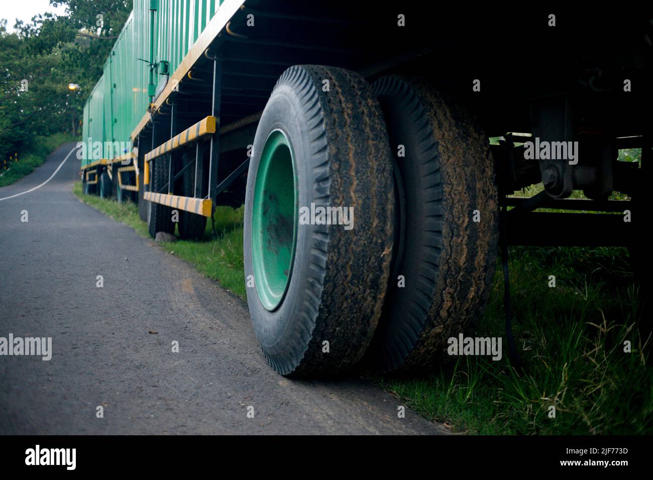 Wheel of truck on the side road Stock Photo