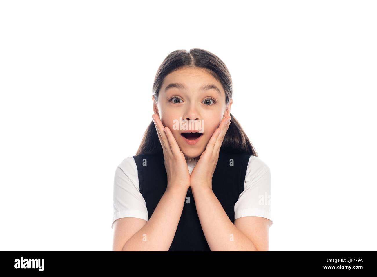 Excited schoolchild looking at camera isolated on white Stock Photo