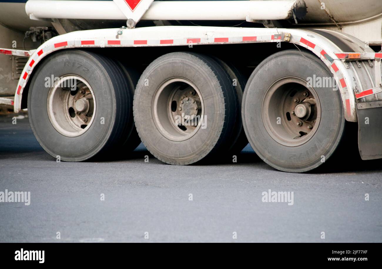Semi trailer truck wheels on the road Stock Photo
