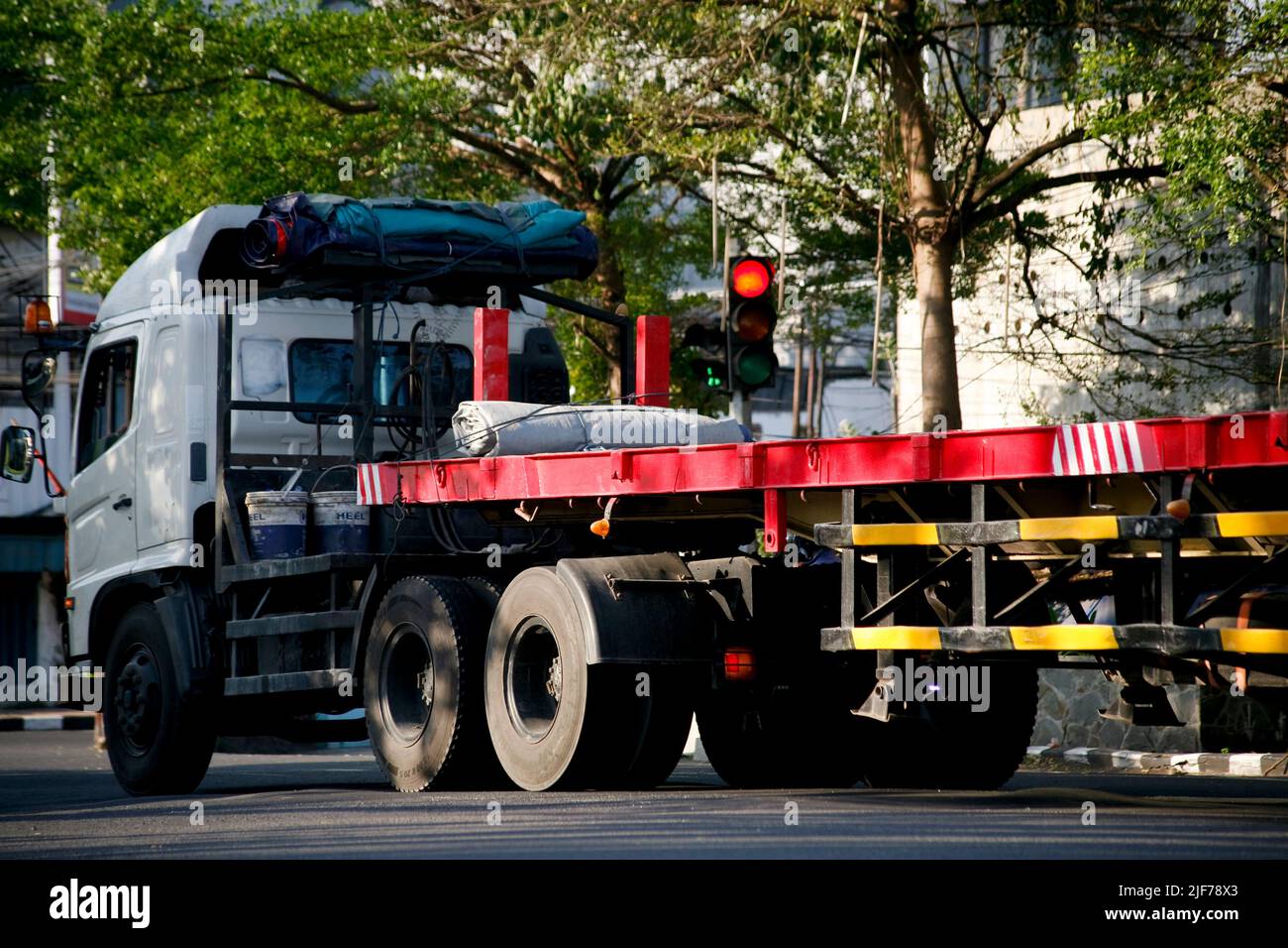 Truck trailer without box in traffic light Stock Photo