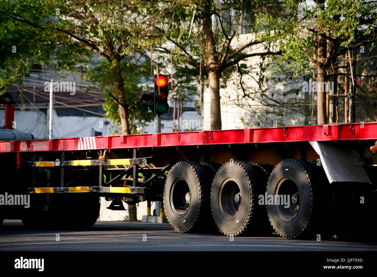 Truck trailer without box in traffic light Stock Photo