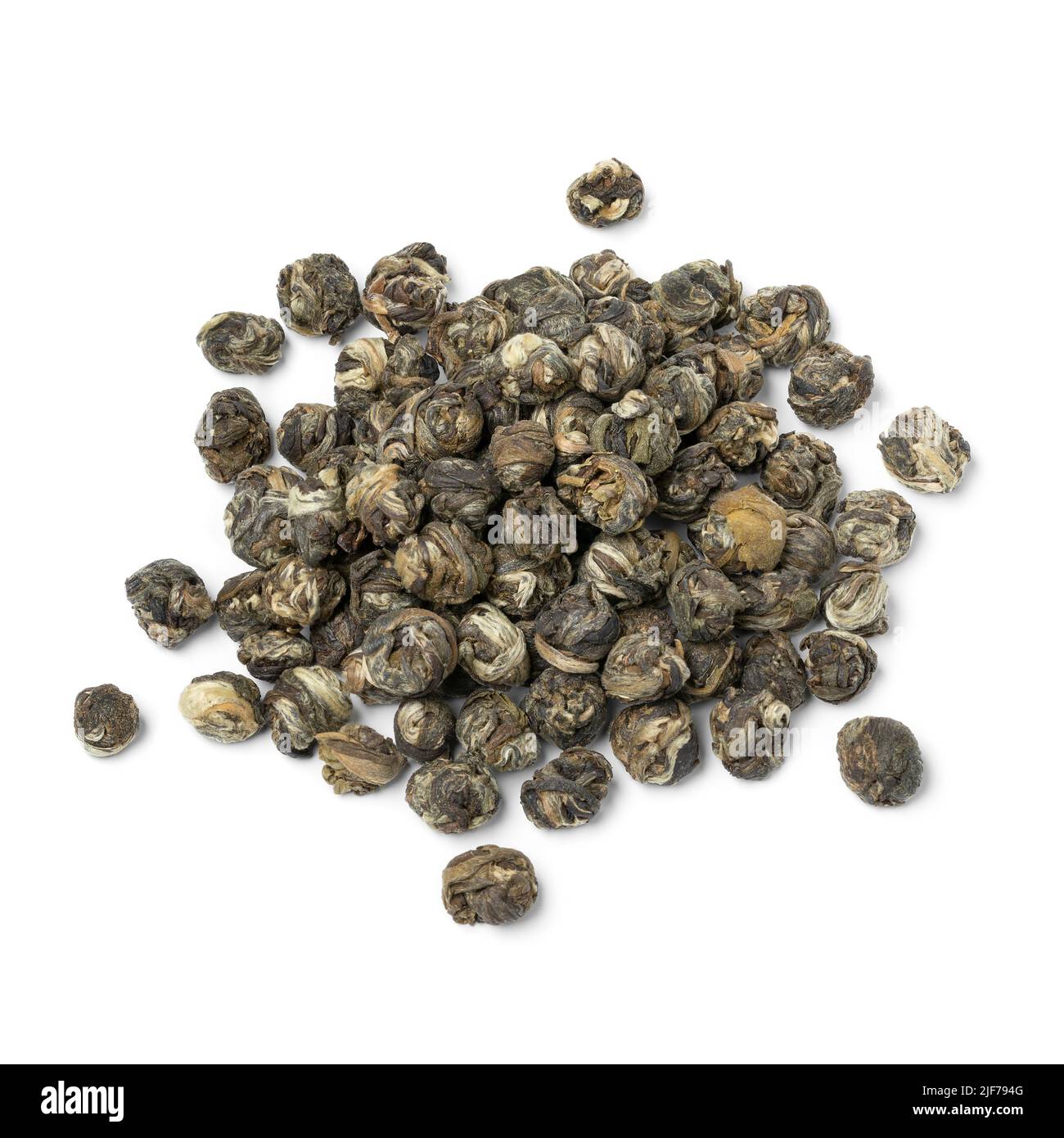 Heap of Chinese Jasmine Dragon pearl tea close up isolated on white