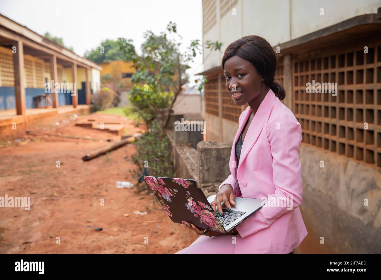 Businesswoman sat uses her laptop and works, women and work in africa Stock Photo