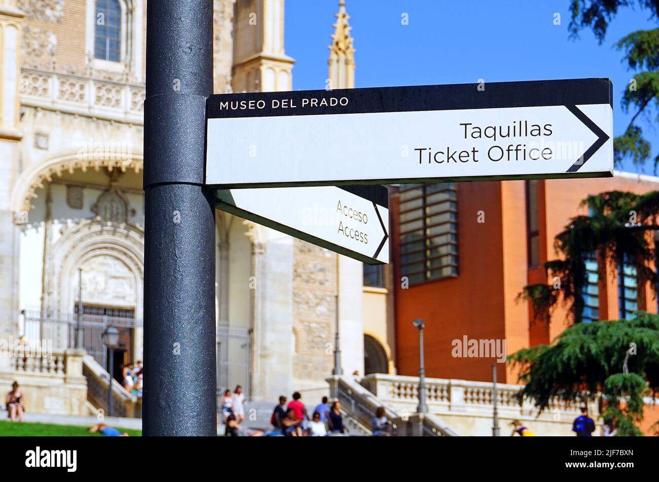 Street sign Ticket Office Taquillas from Prado Museum Museo del Prado in Madrid.With Saint Jerome the Royal (San Jerónimo el Real) at the background.An early 16th-century Roman Catholic church. Stock Photo