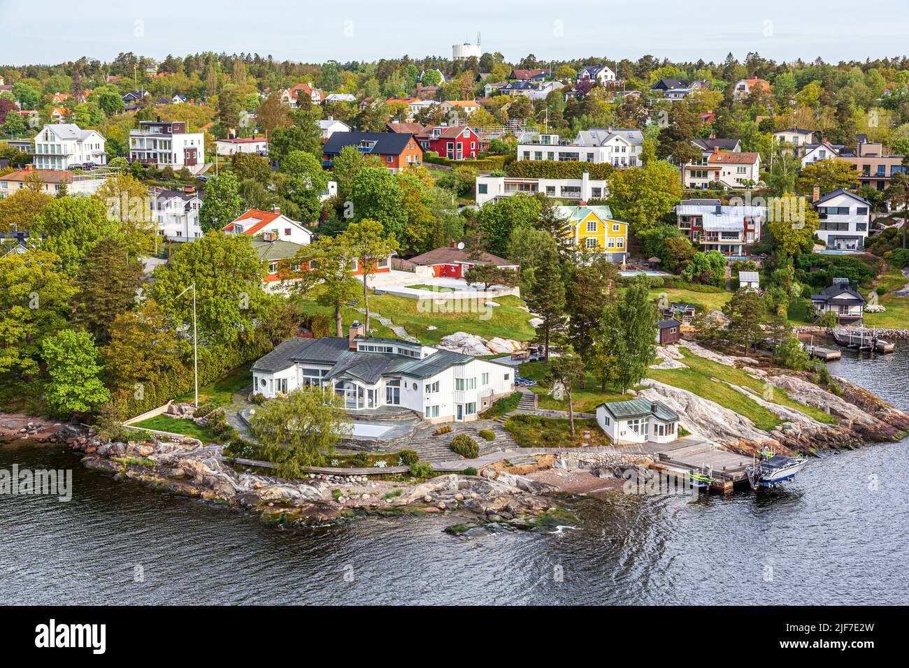 Waterside properties on one of the many islands of the Stockholm Archipelago - here Gashaga on the island of Lidingo, Sweden. Stock Photo