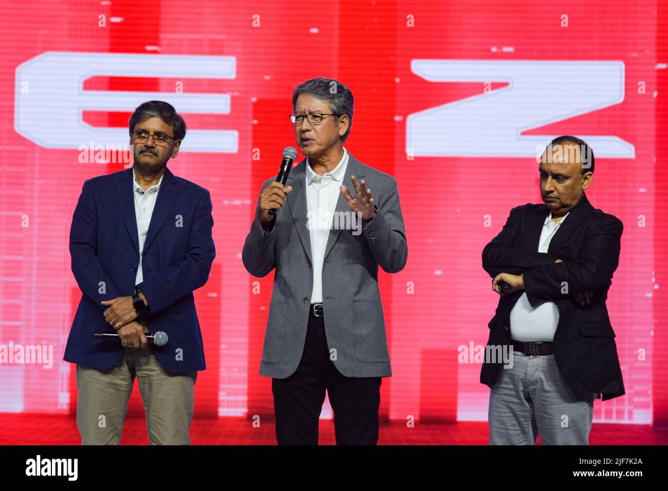 Gurugram, Haryana, India. 30th June, 2022. Managing Director & CEO Maruti Suzuki India Limited Hisashi Takeuchi (C), Executive Director Shashank Srivastava (R) and CTO CV Raman (L) stand on stage during the launch event of Maruti Suzuki Brezza at Gurugram, India. (Credit Image: © Kabir Jhangiani/Pacific Press via ZUMA Press Wire) Stock Photo