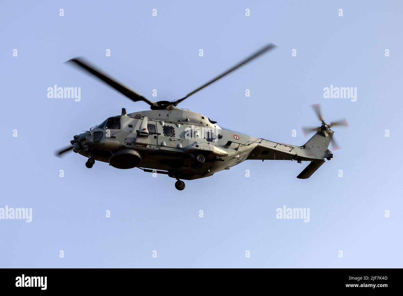 French Navy NHI NH-90 NFH (Reg.: 6) helicopter performing some approaches on runway 23 in the early morning. Stock Photo