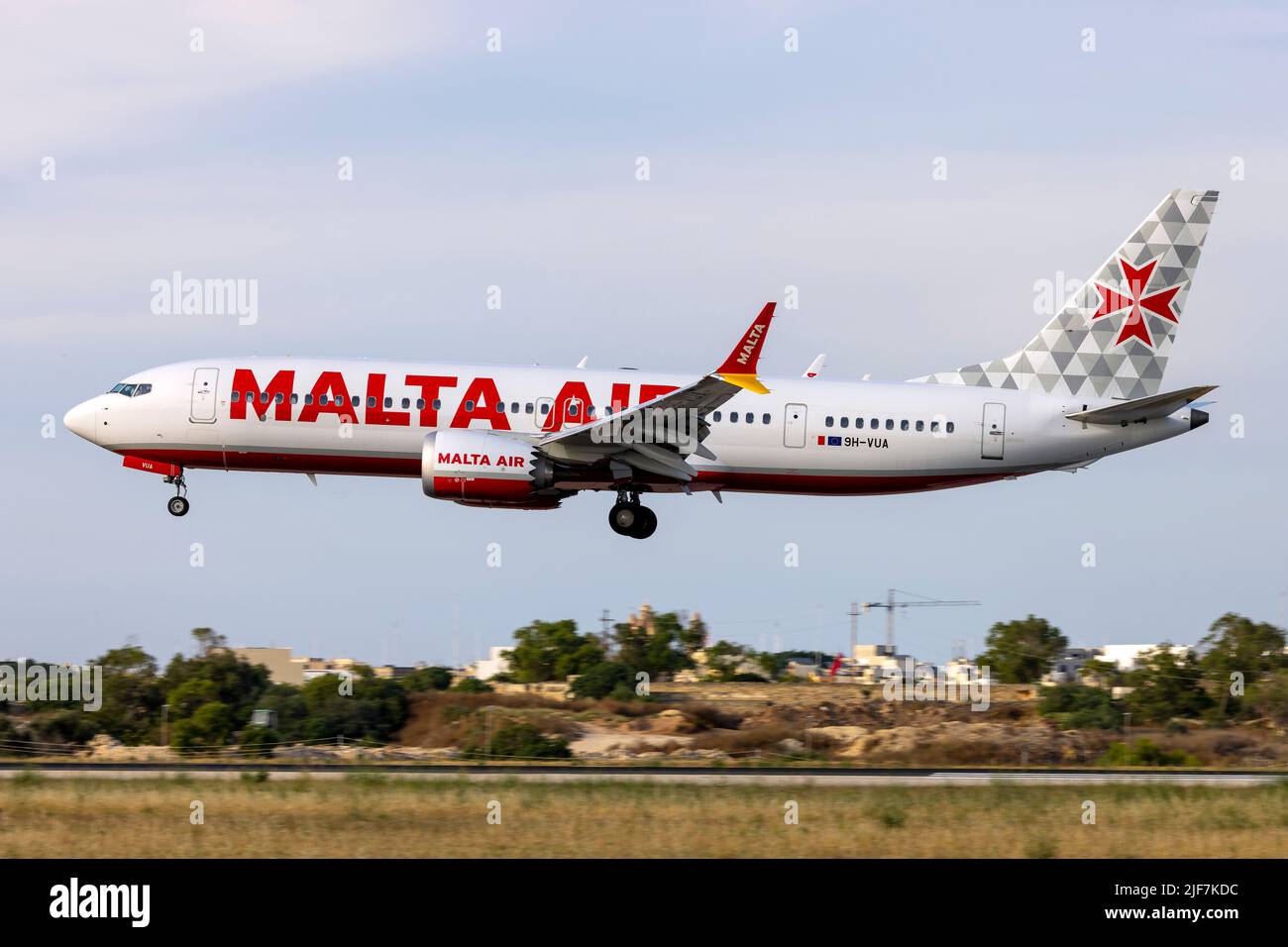 Malta Air Boeing 737-8 MAX 200 (REG: 9H-VUA) on finals runway 31 in the evening Stock Photo