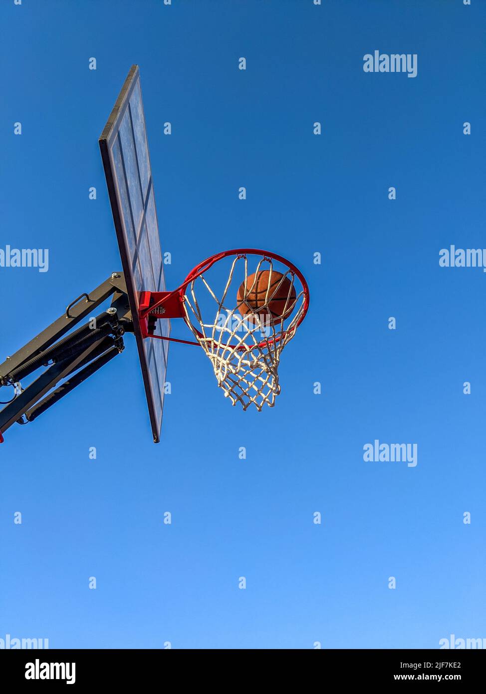 Ball in a basket on a background of clear sky Stock Photo
