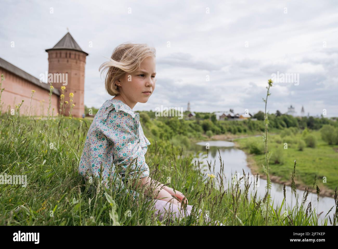 Portrait of a thoughtful girl in nature by the river Stock Photo - Alamy