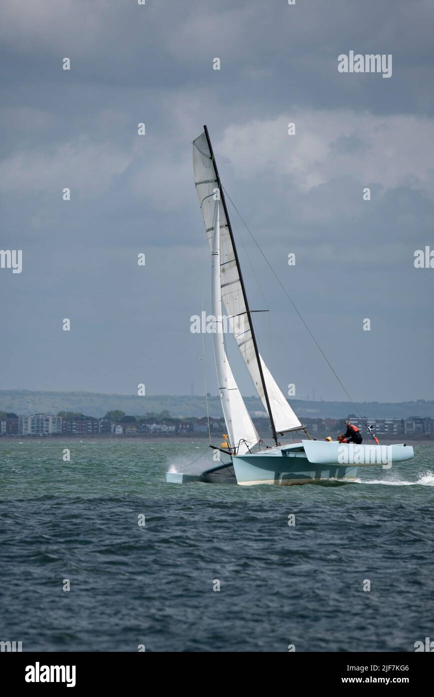 Nick Barlow's Trimaran Kittiwake flying across the Solent on her way to a superb 3rd position in the Isle of Wight Sailing Club's Round The Island Stock Photo