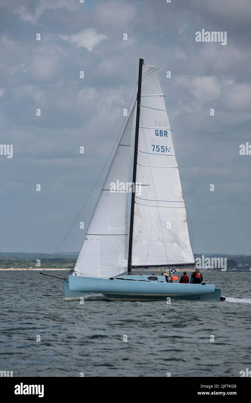 Nick Barlow Trimaran Kittiwake flying across the Solent on her way to a superb 3rd position in the Isle of Wight Sailing Club's Round The Island Race Stock Photo