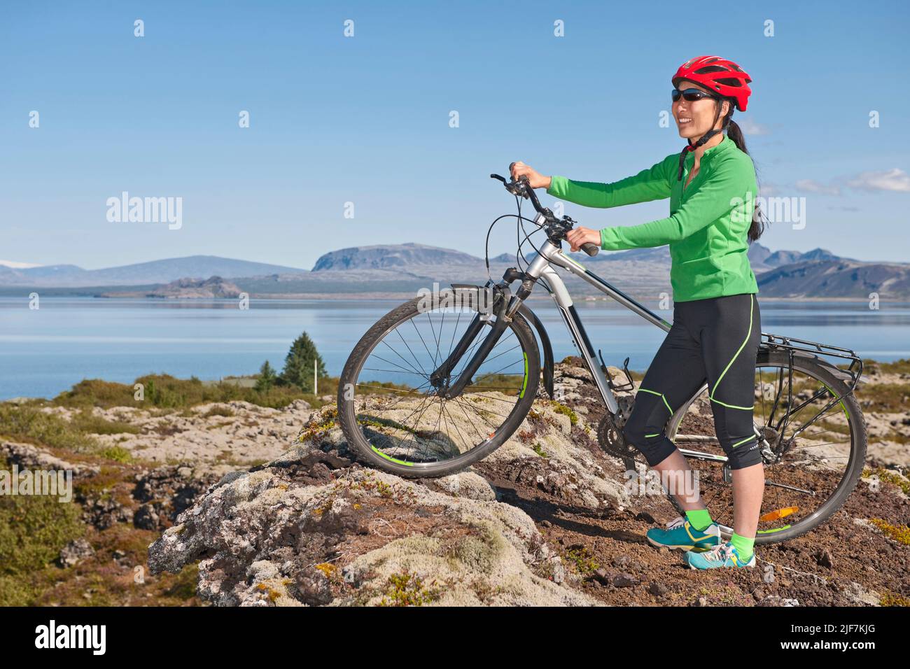 Korean woman exploring Nesjavellir on her mountain Bike Stock Photo Alamy