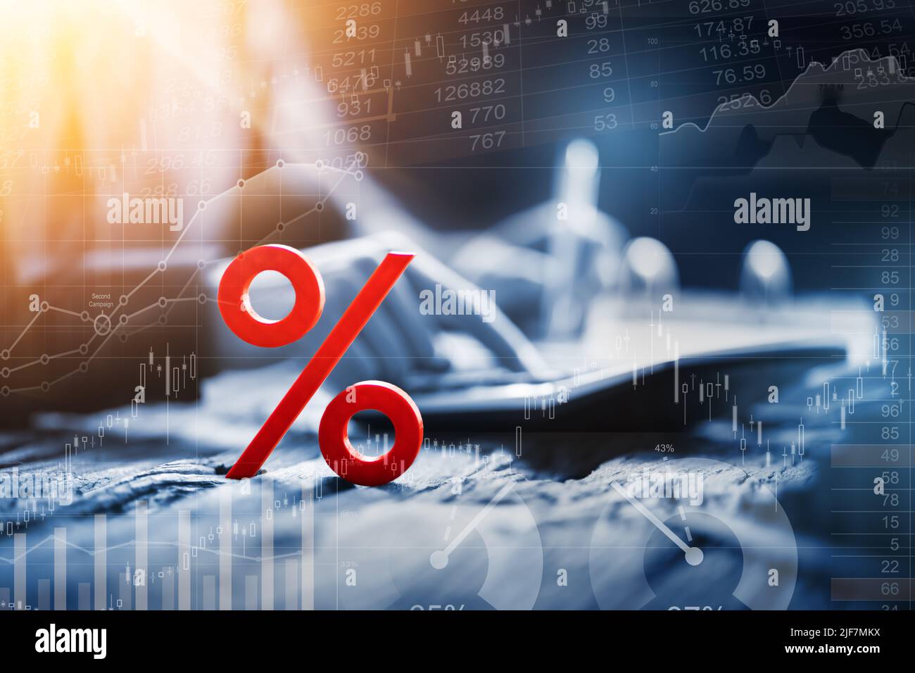 Close-up Of Red Percentage Symbol In Front Of Businessperson Calculating Invoice Stock Photo