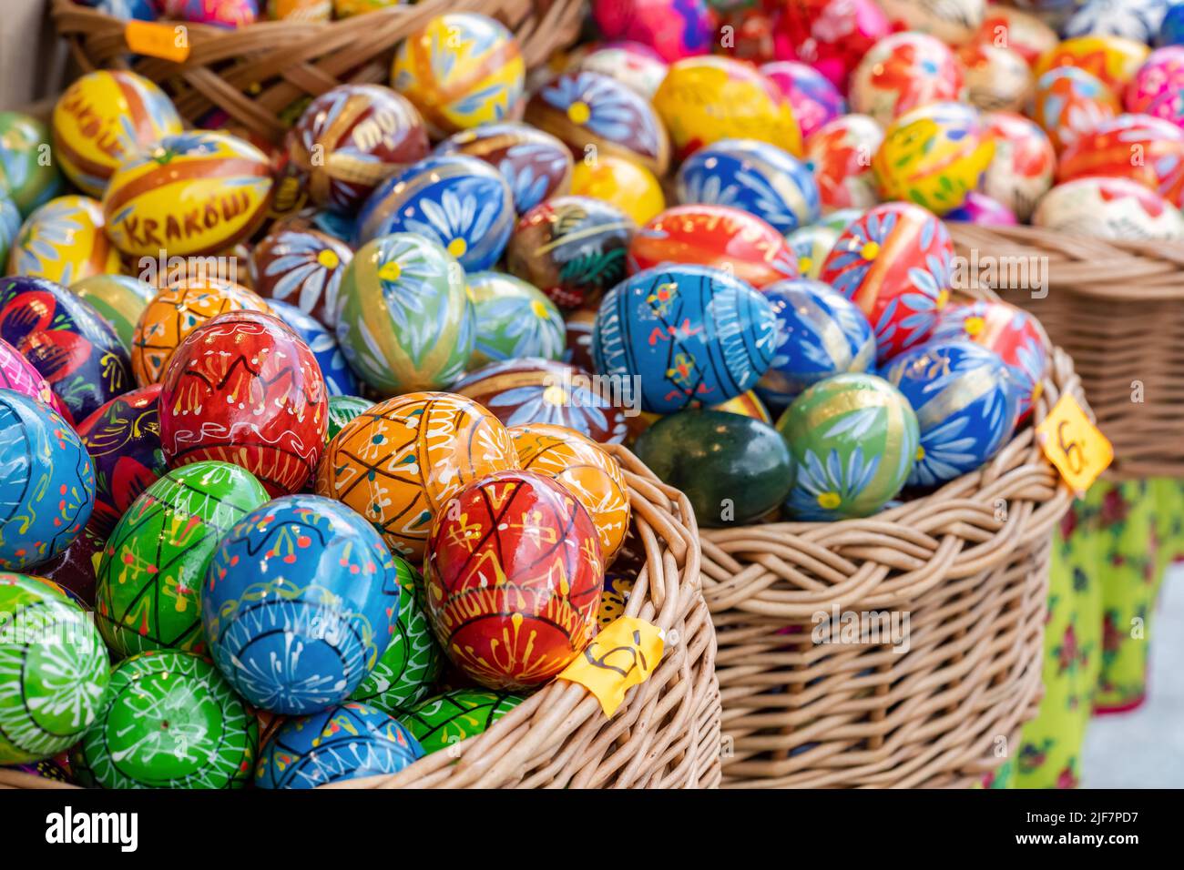 Group of colorful handmade Easter eggs in a few baskets, set of handcrafted traditional Polish pisanki, group of objects, detail, closeup, nobody. Eas Stock Photo