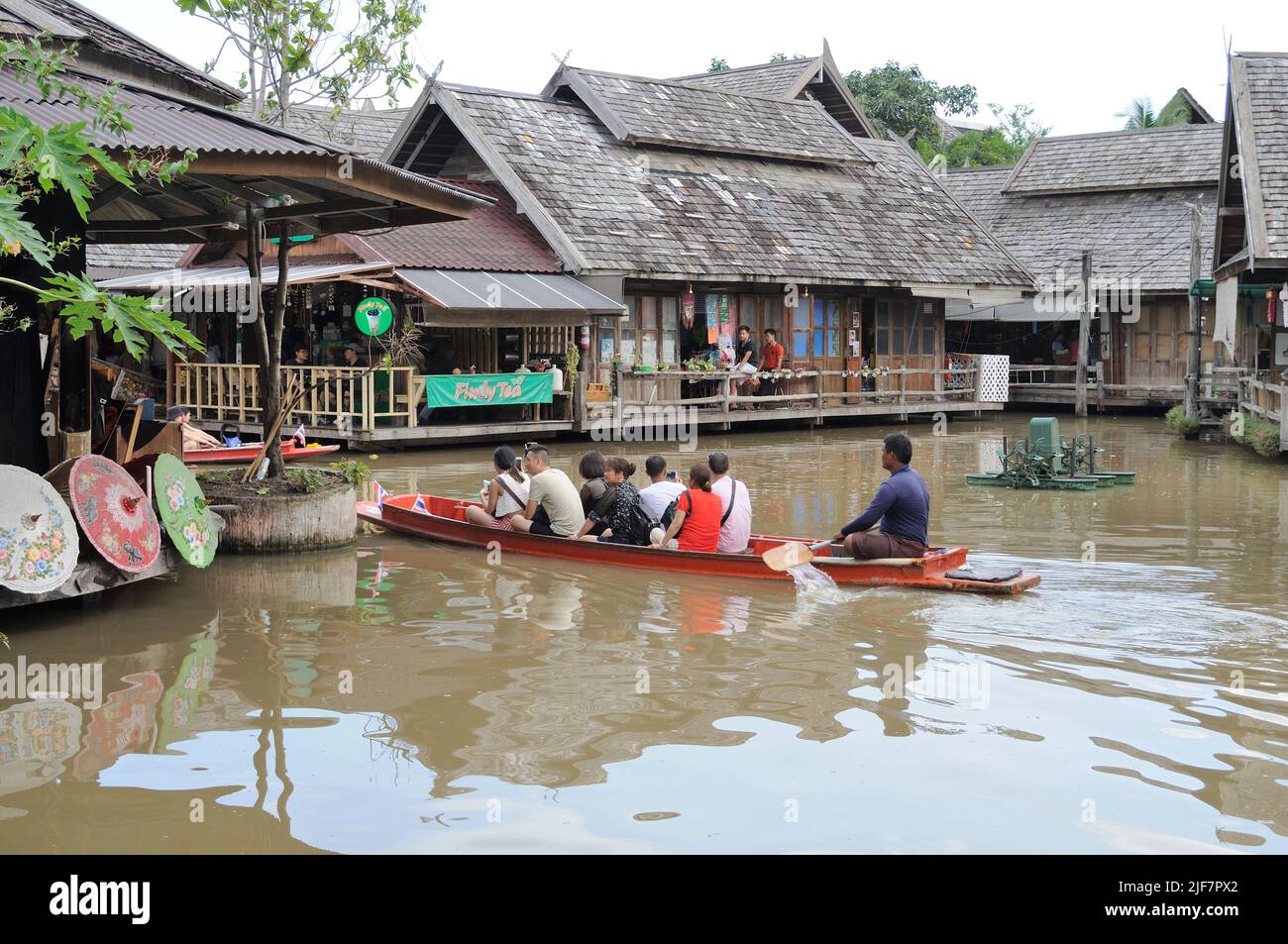 Asian people houses paddle boat hi-res stock photography and images - Alamy