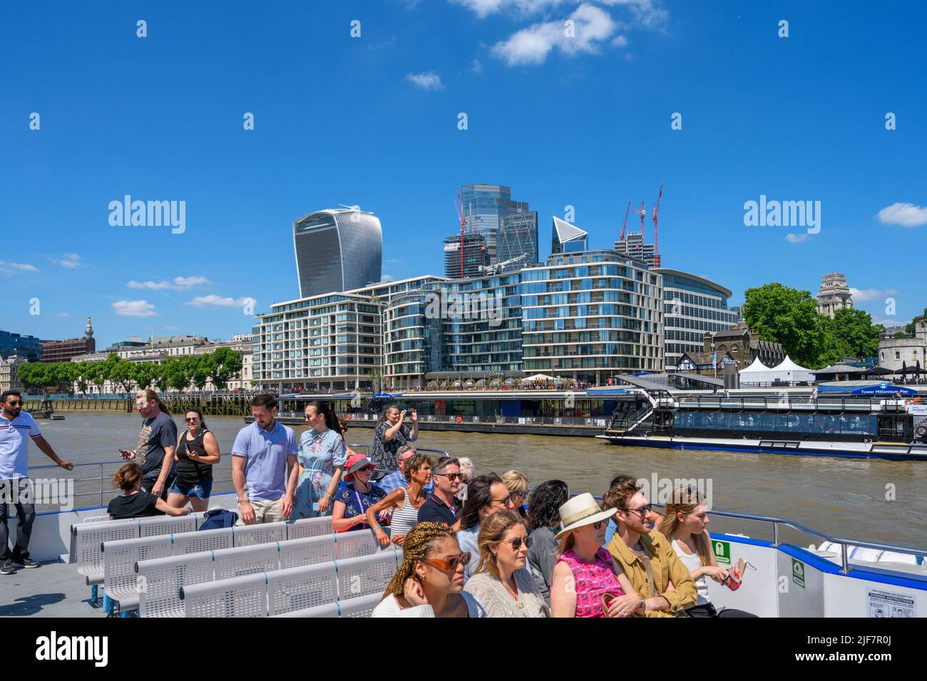 The City skyline from the deck of a City Cruises boat trip, 20 Fenchurch Street (Walkie Talkie building) to the left, River Thames, London, UK Stock Photo