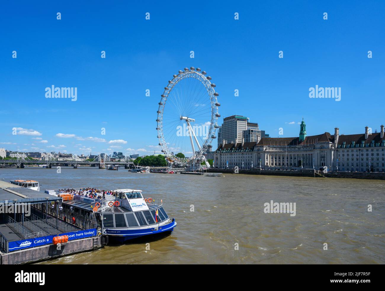The London Eye and City Cruises boat trip at Westminster Pier, River Thames, London, England, UK Stock Photo