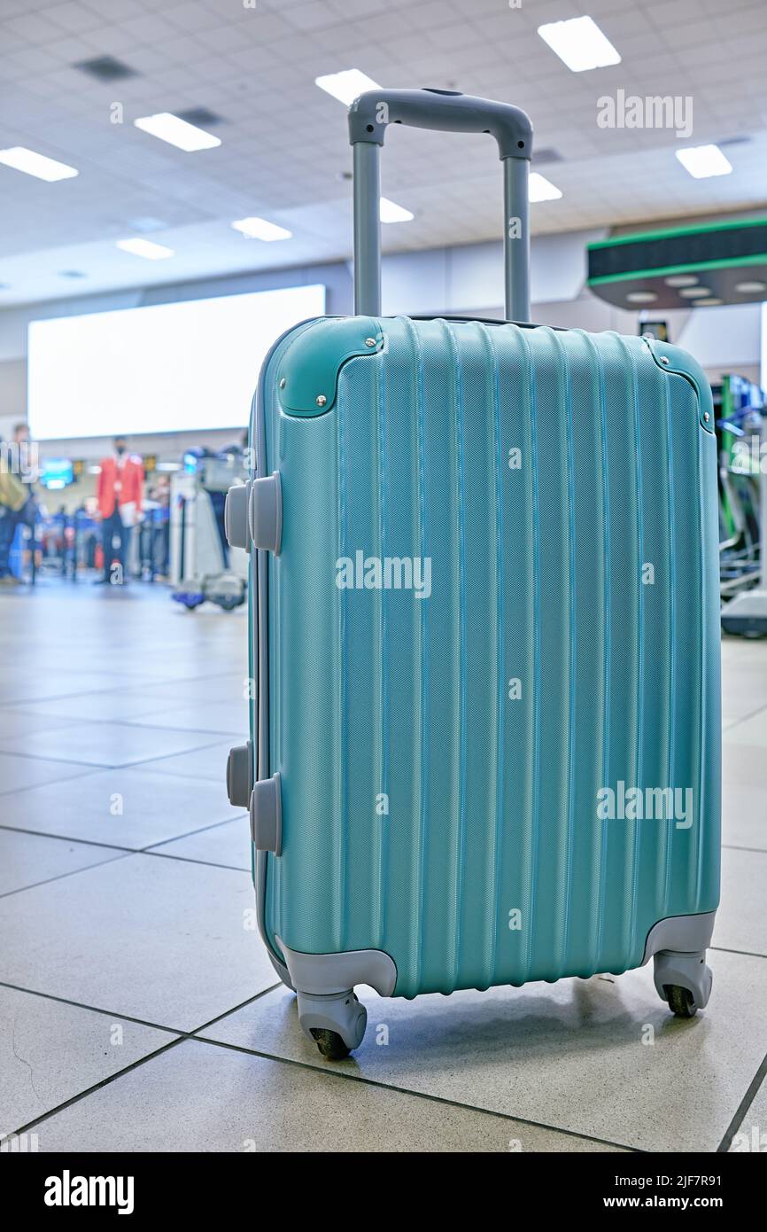 Suitcase or baggage with airport luggage trolley in the international