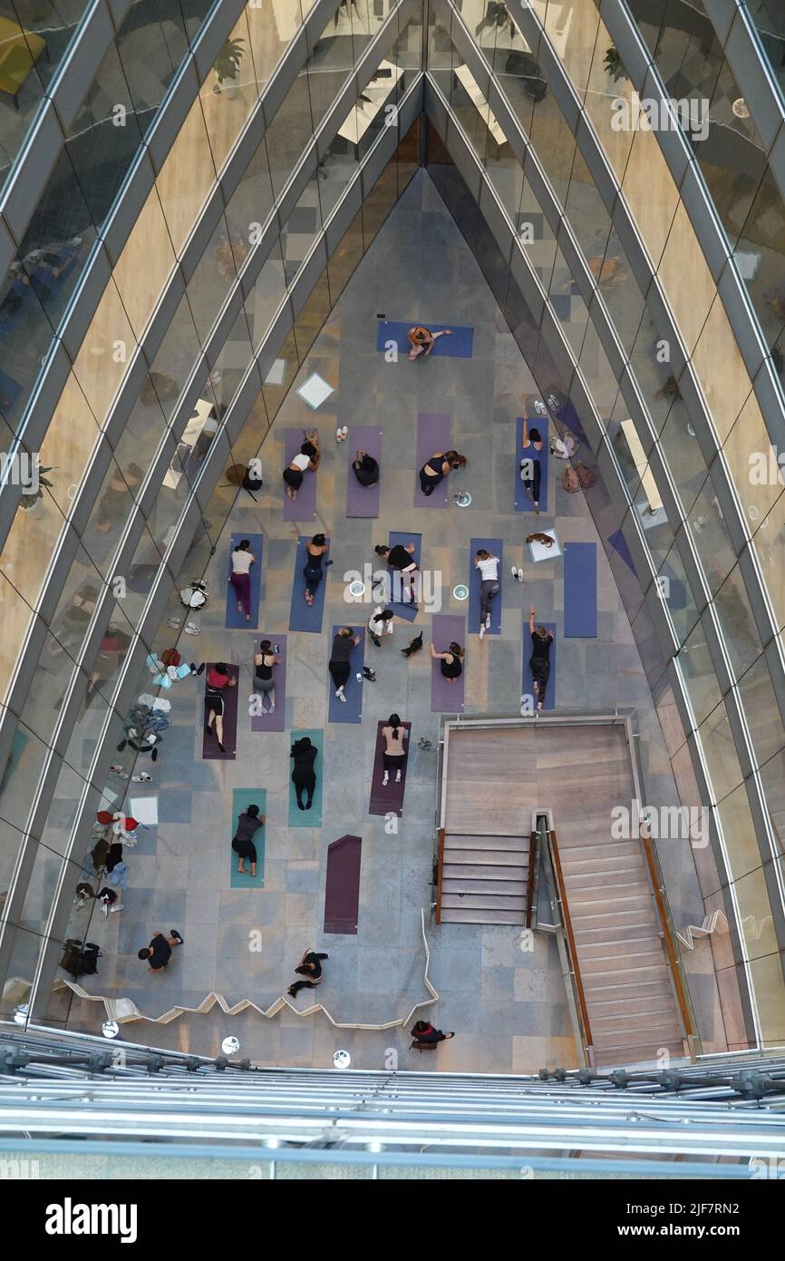 Office yoga viewed from above in perfect symmetry Stock Photo
