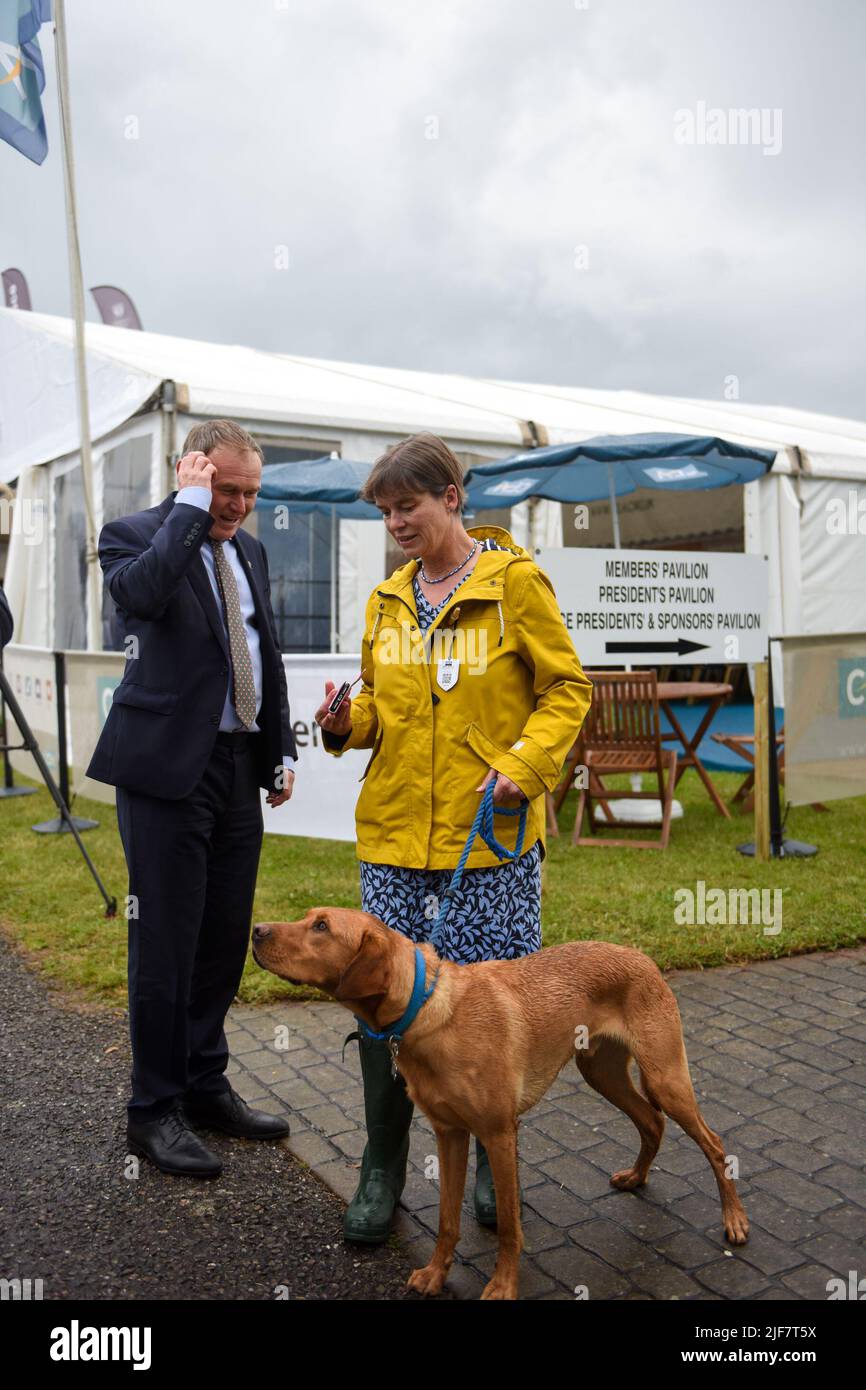 George Eustice MP, Secretary of State for Environment, Food and Rural Affairs of the United Kingdom, MP For Camborne, Meets with Selaine Saxby MP for North Cornwall, and her Dog Henry. At the Devon County Show. Stock Photo