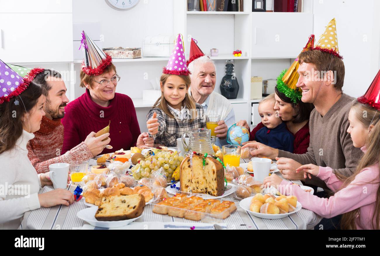 family proposing festive toasts during Christmas dinner Stock Photo Alamy