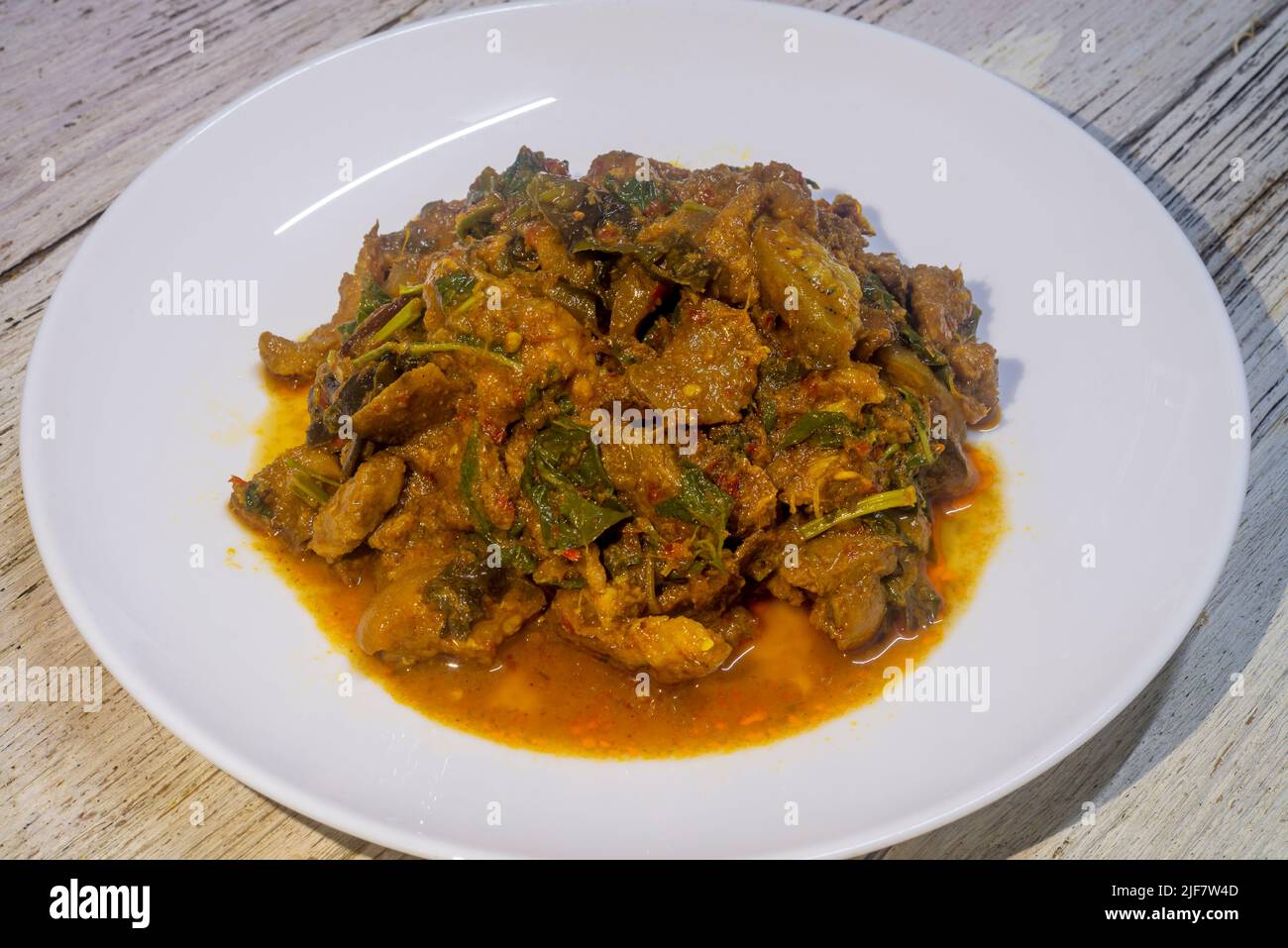 Spicy stirfried wild boar in a white dish. Thai food stirfried spicy