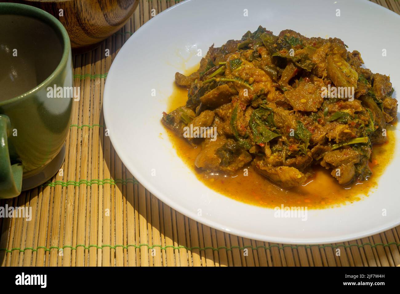 Spicy stirfried wild boar in a white dish. Thai food stirfried spicy
