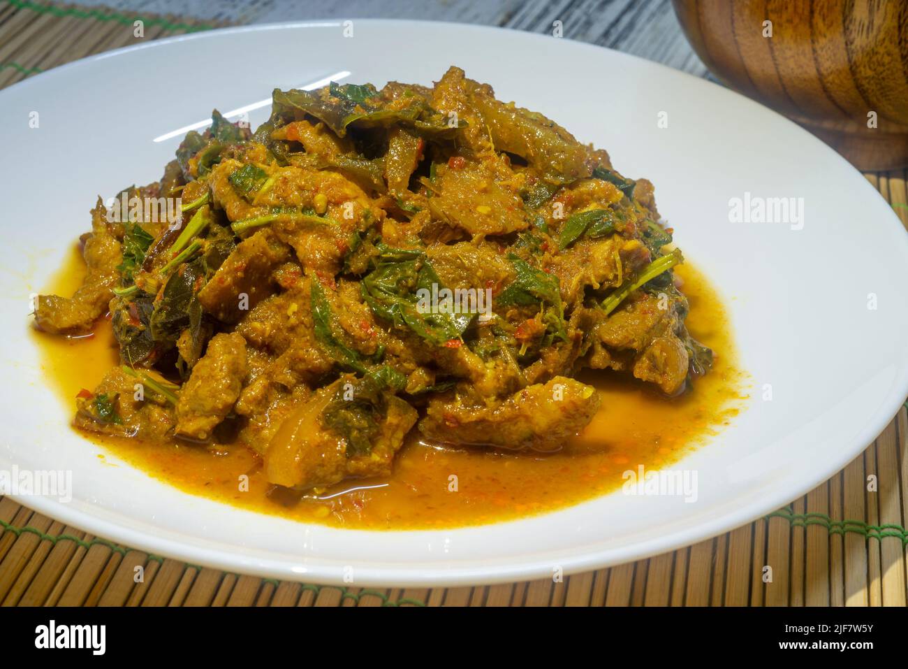 Spicy stirfried wild boar in a white dish. Thai food, spicy stirfried