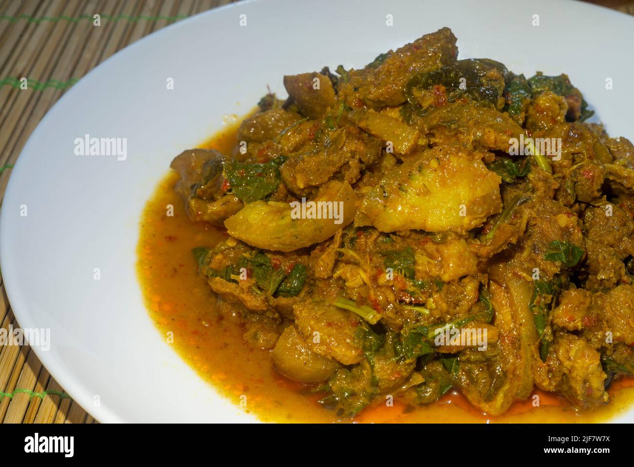 Spicy stirfried wild boar in a white dish. Thai food, spicy stirfried