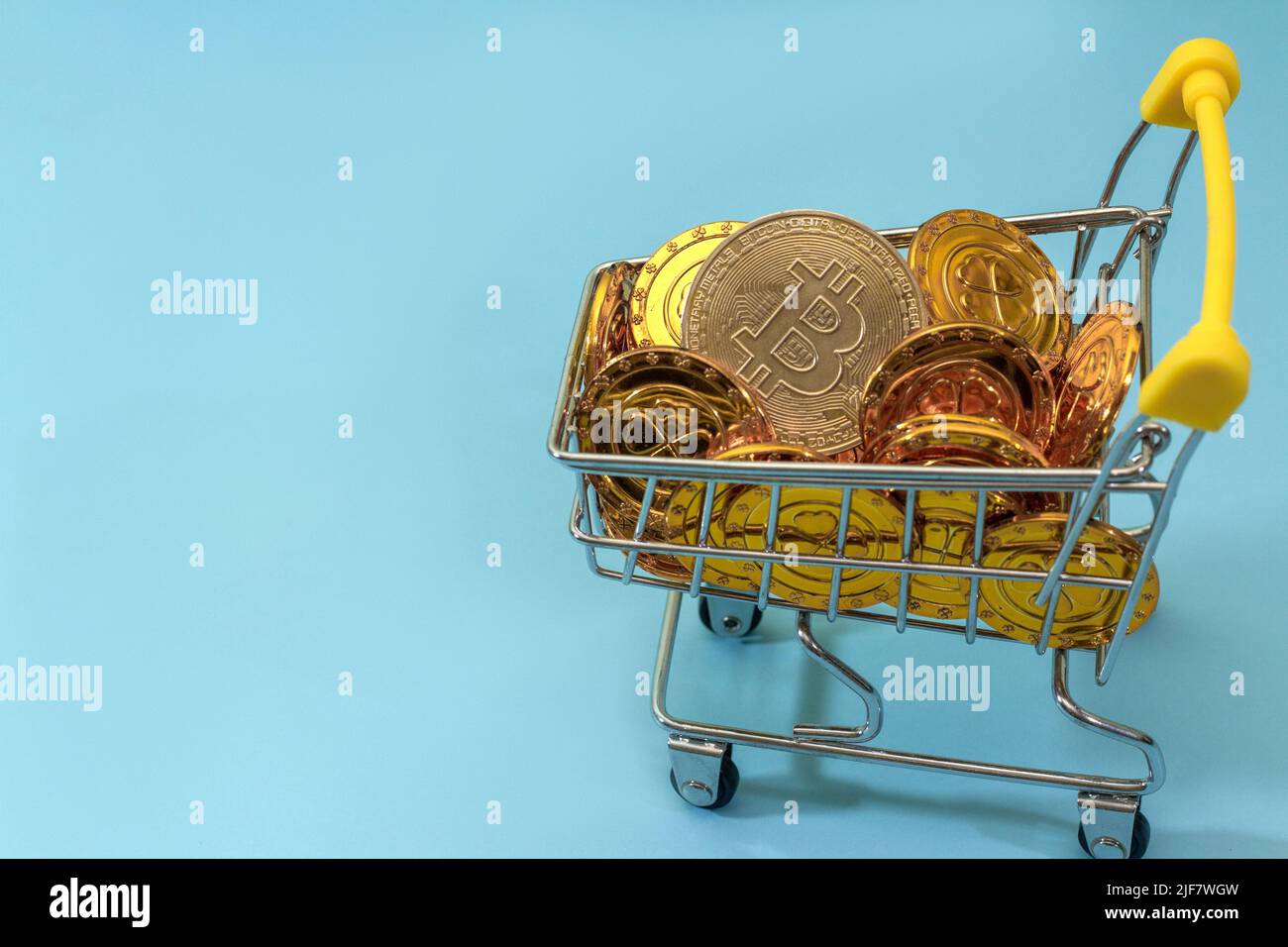 Bitcoin coins in a shopping trolley and a Scottish fold cat. Virtual cryptocurrency  purchase concept. Black background. Bitcoin mining, online busines Stock  Photo - Alamy
