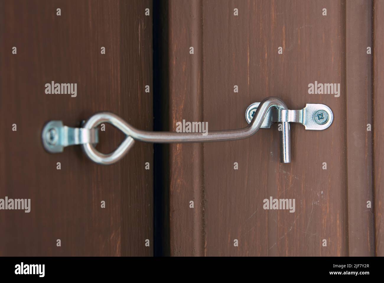 Rustic hook and eye door lock for doors locking Stock Photo Alamy