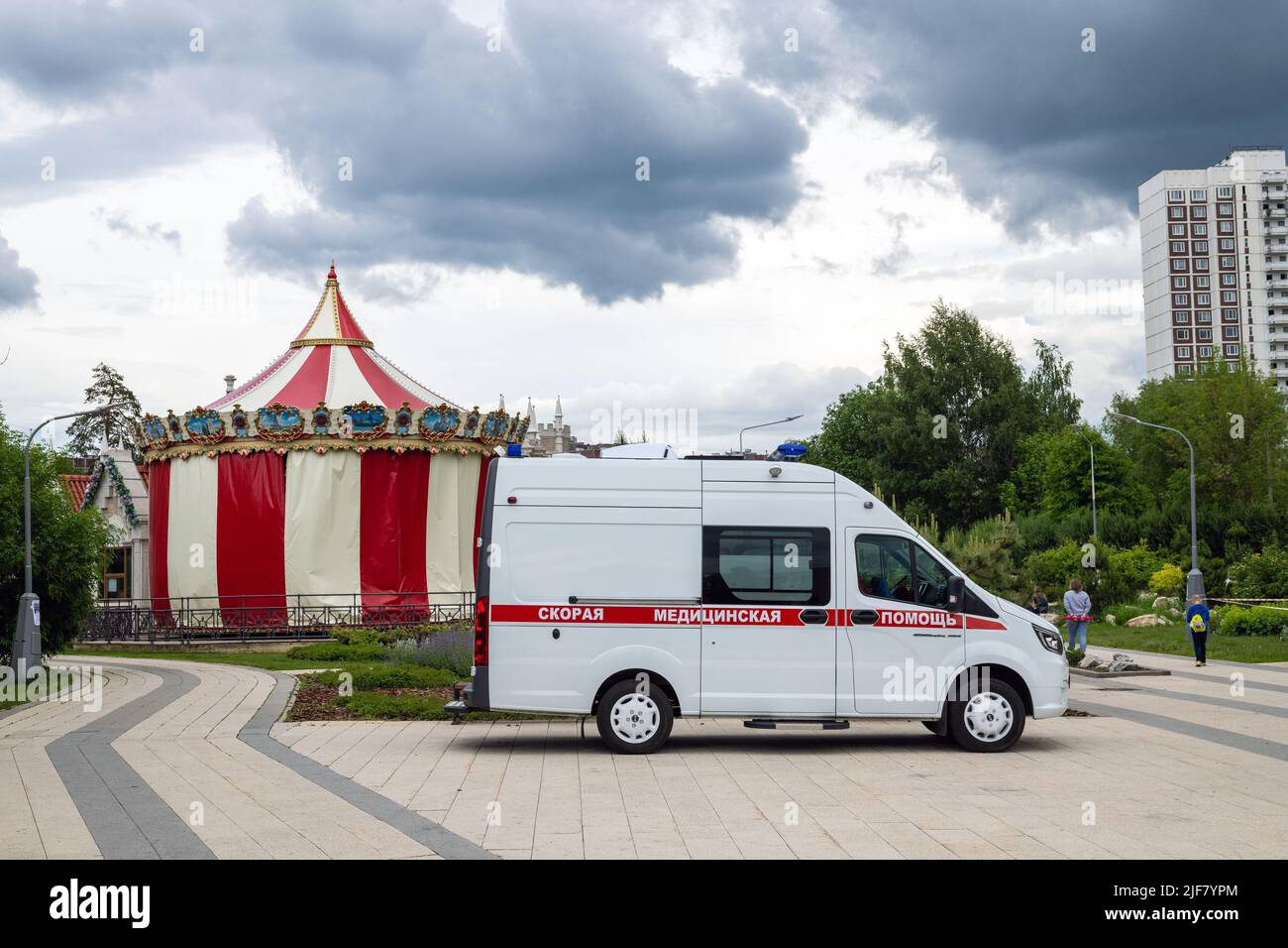 Moscow, Russia - June 17. 2022. An ambulance is on duty near children's entertainment center Stock Photo