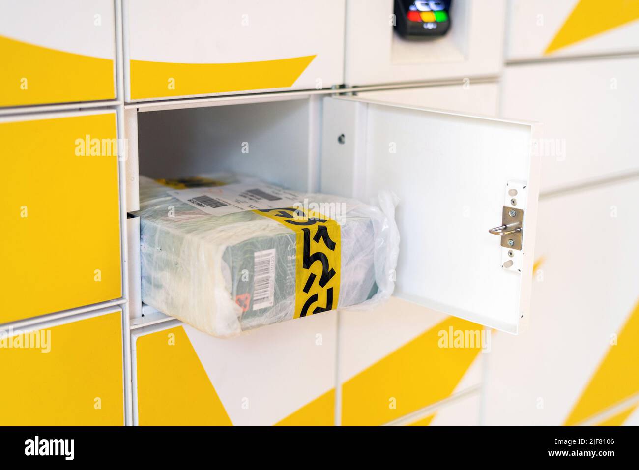 Moscow, Russia - June 17. 2022. Parcel from the delivery service Yandex Market in the cell postamat Stock Photo