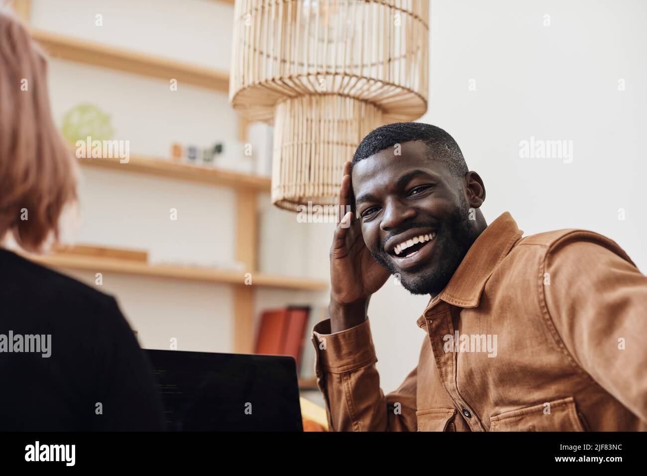 Portrait of happy male computer programmer at tech start-up office Stock Photo