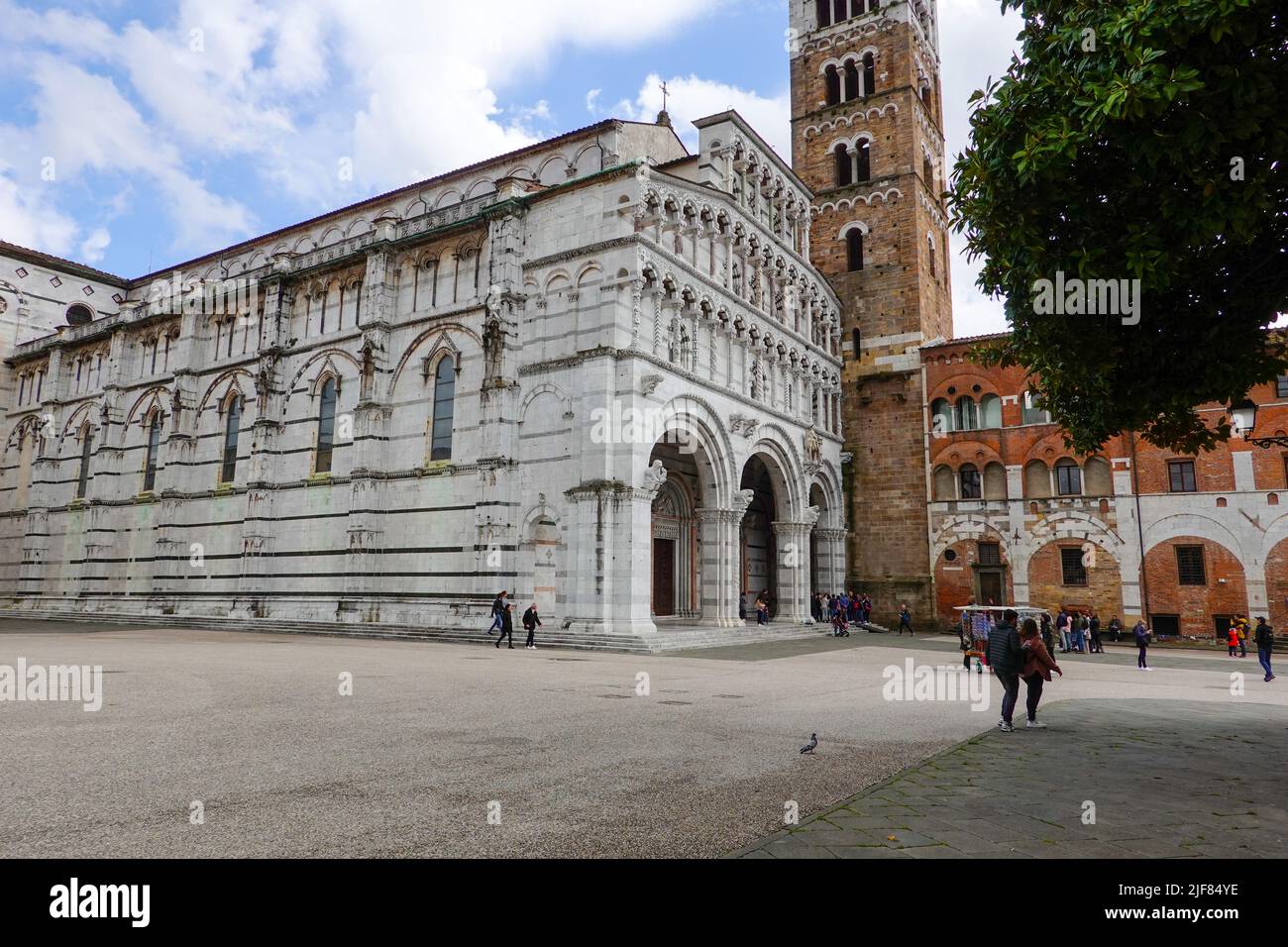 People in the Piazza San Martino in front of the Duomo of Luca, Italy, a part of Tuscany. Stock Photo