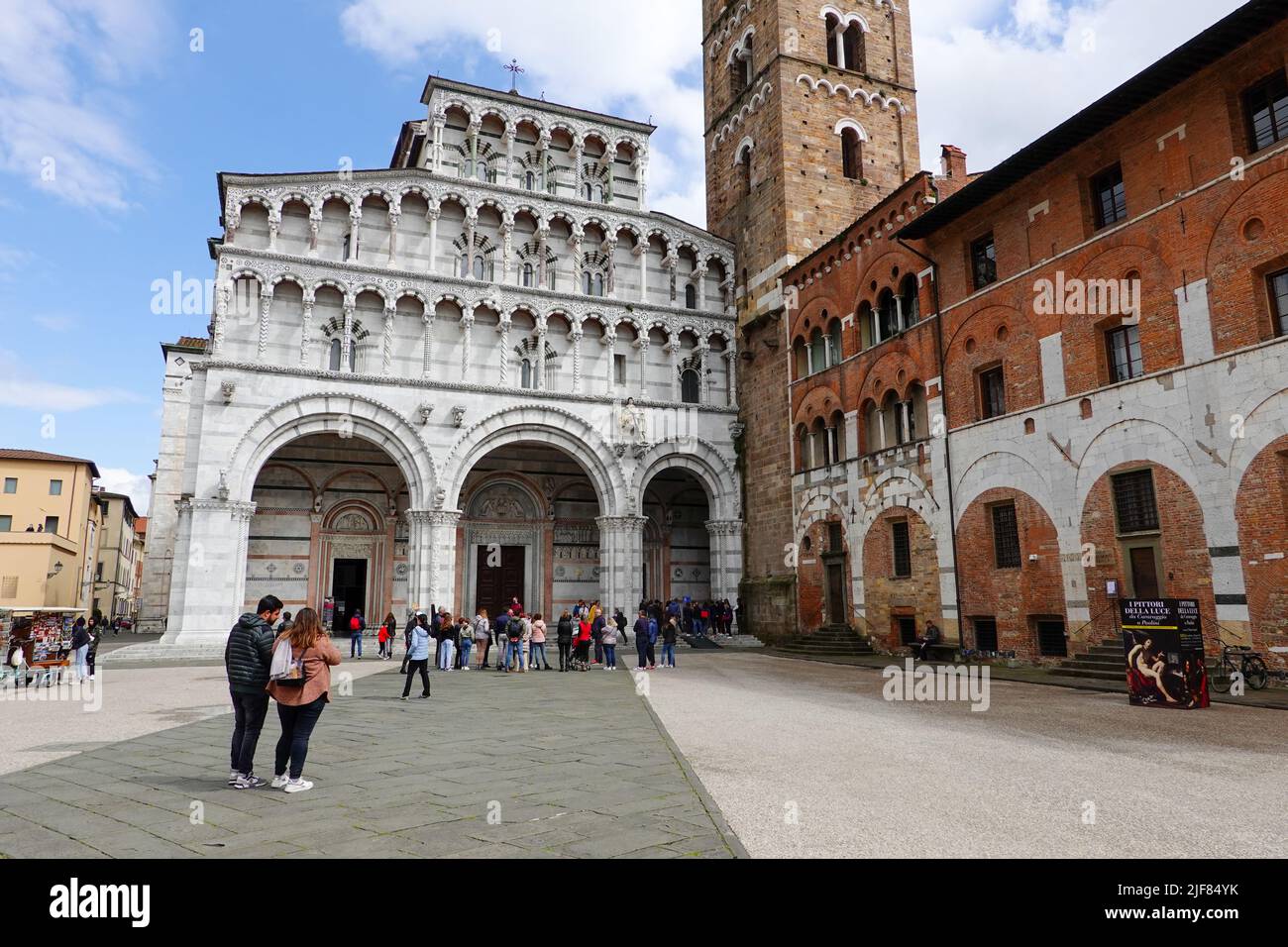 People in the Piazza San Martino in front of the Duomo of Luca, Italy, a part of Tuscany. Stock Photo