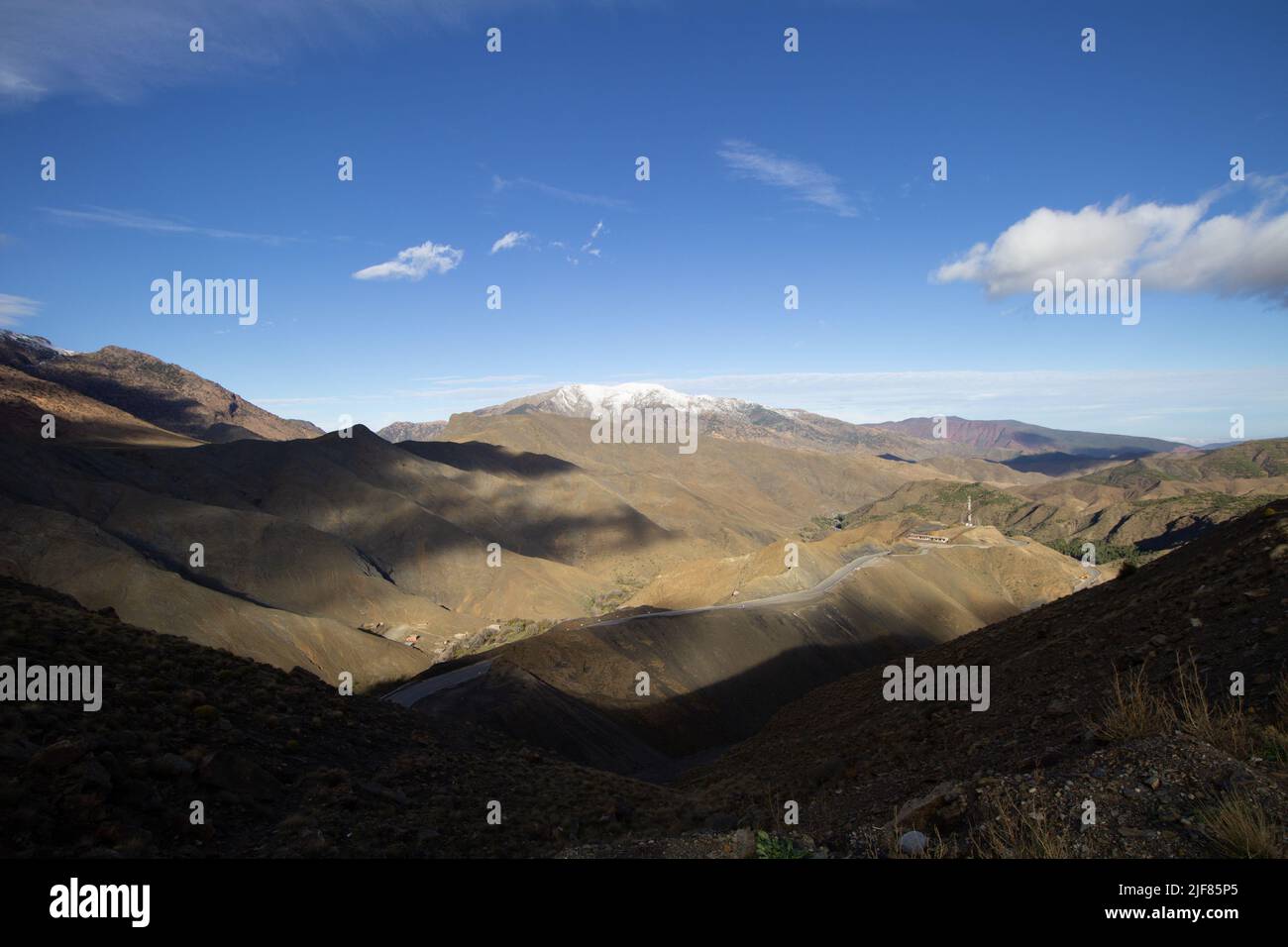 shadows on the hill side with a clear blue sky in the High Atlas mountains Stock Photo