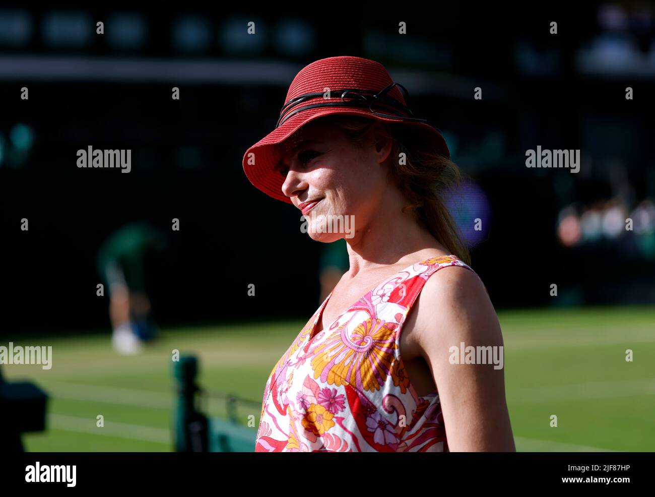 A spectator poses for a photo during day four of the 2022 Wimbledon Championships at the All England Lawn Tennis and Croquet Club, Wimbledon. Picture date: Thursday June 30, 2022. Stock Photo