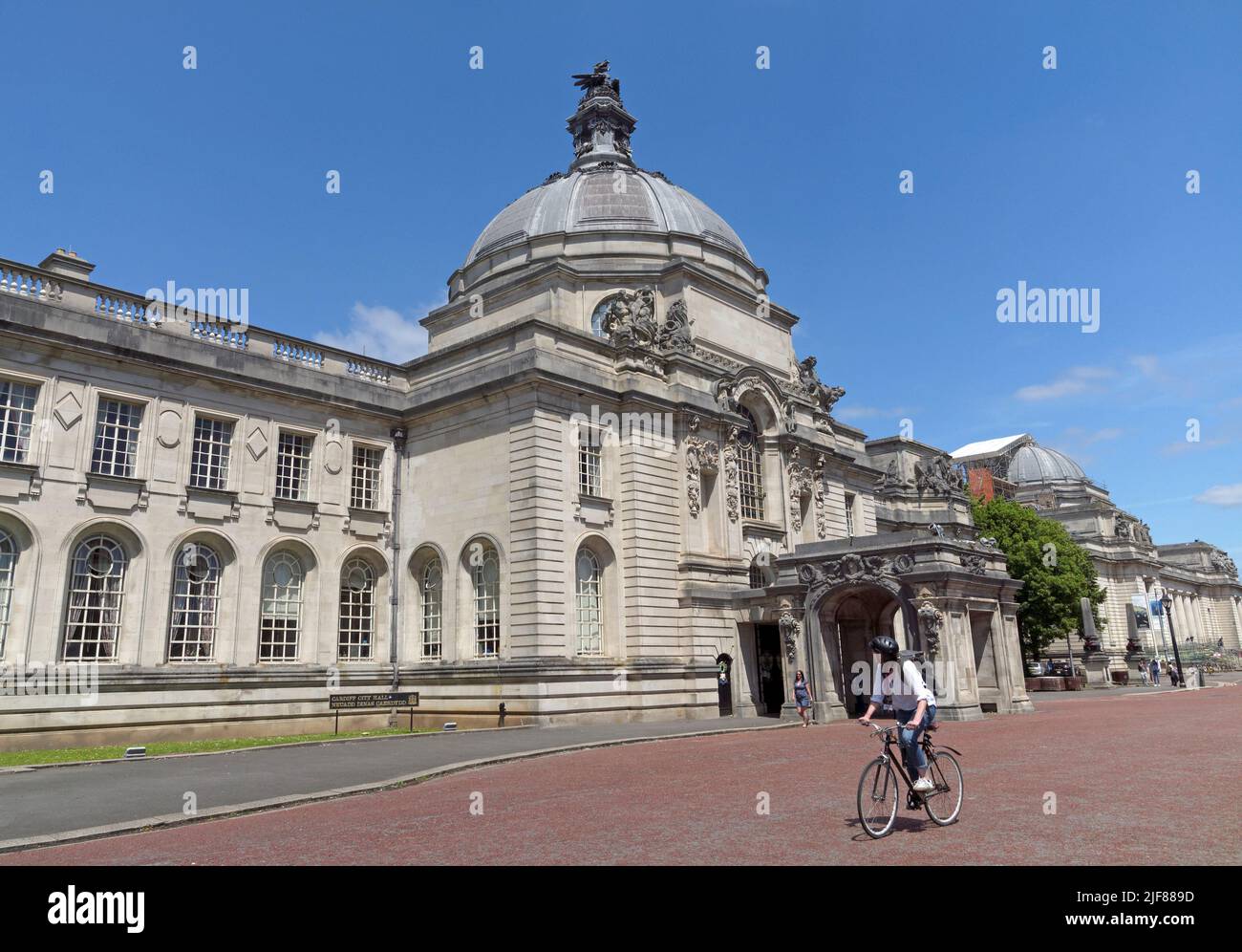 Cardiff City Hall with dragon statue on roof cupola. Summer 2022. July. Blue sky, light cloud. Welsh Dragon statue - Henry Charles Fehr Stock Photo