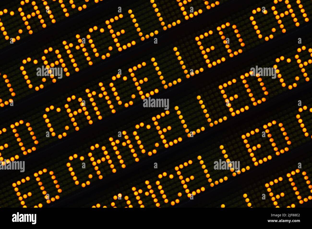 A Close Up Of The Word Cancelled Repeated Multiple Times On A Sign At A Station Or Airport Stock Photo