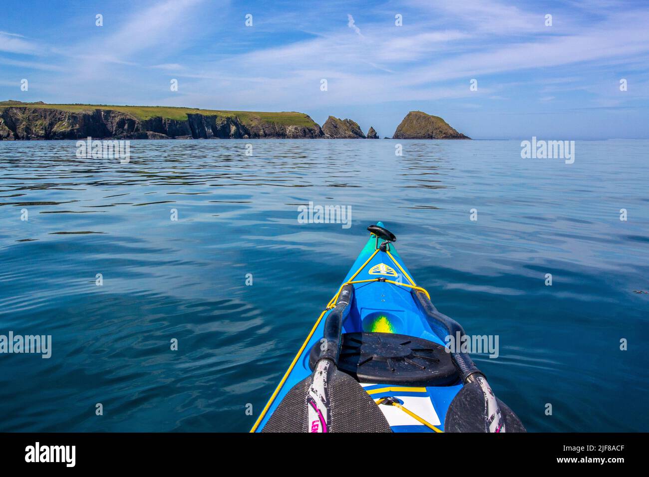 Sea kayaking near Abercastle off the Pembrokeshire Coast in Wales Stock Photo