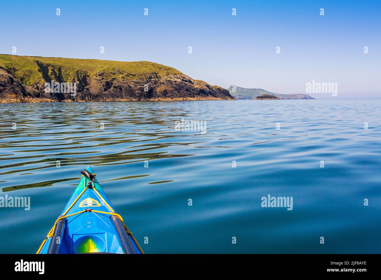 Sea kayaking off St Davids Head  on the Pembrokeshire Coast in Wales Stock Photo