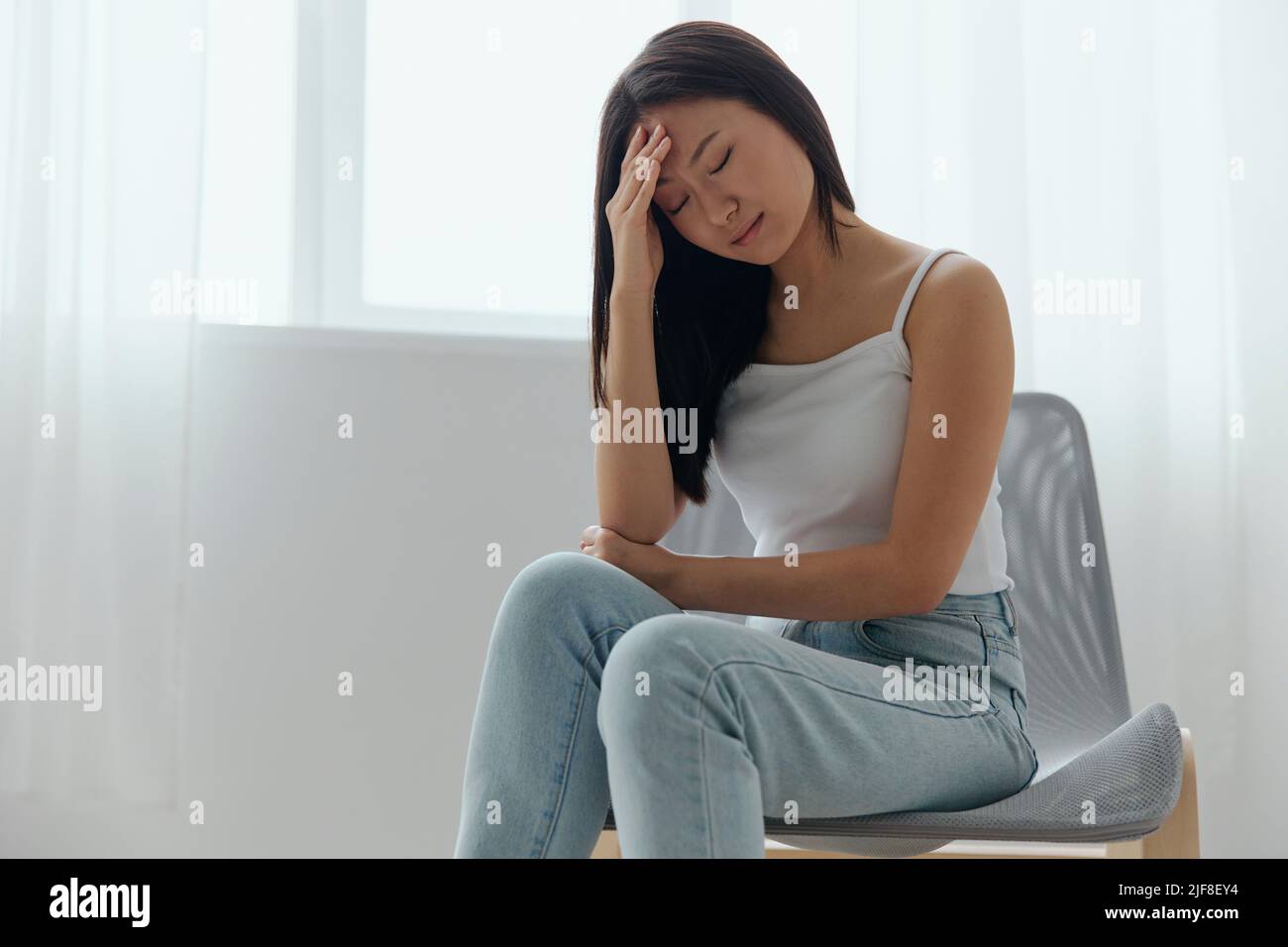 Elevated temperatures. CoVID symptoms. Tormented tanned beautiful young