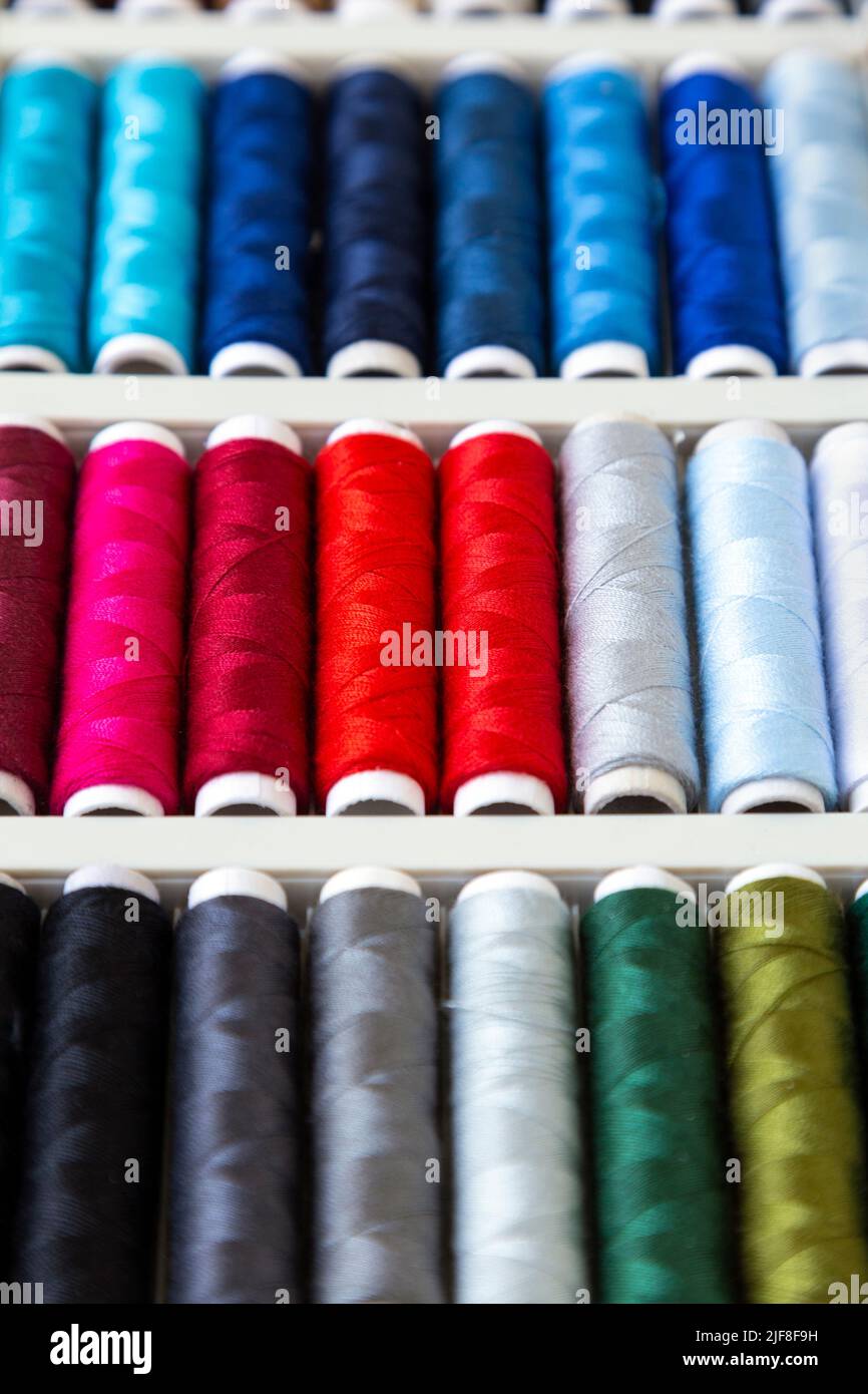 Colourful thread bobbins background Stock Photo