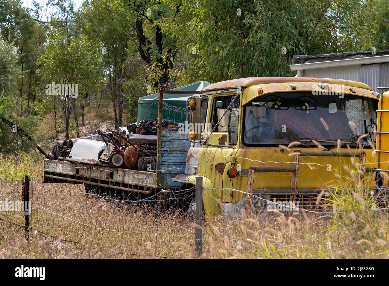 Rubyvale Gemfields Fosscing An old yellow truck full of rusting sapphire mining equipment on ...