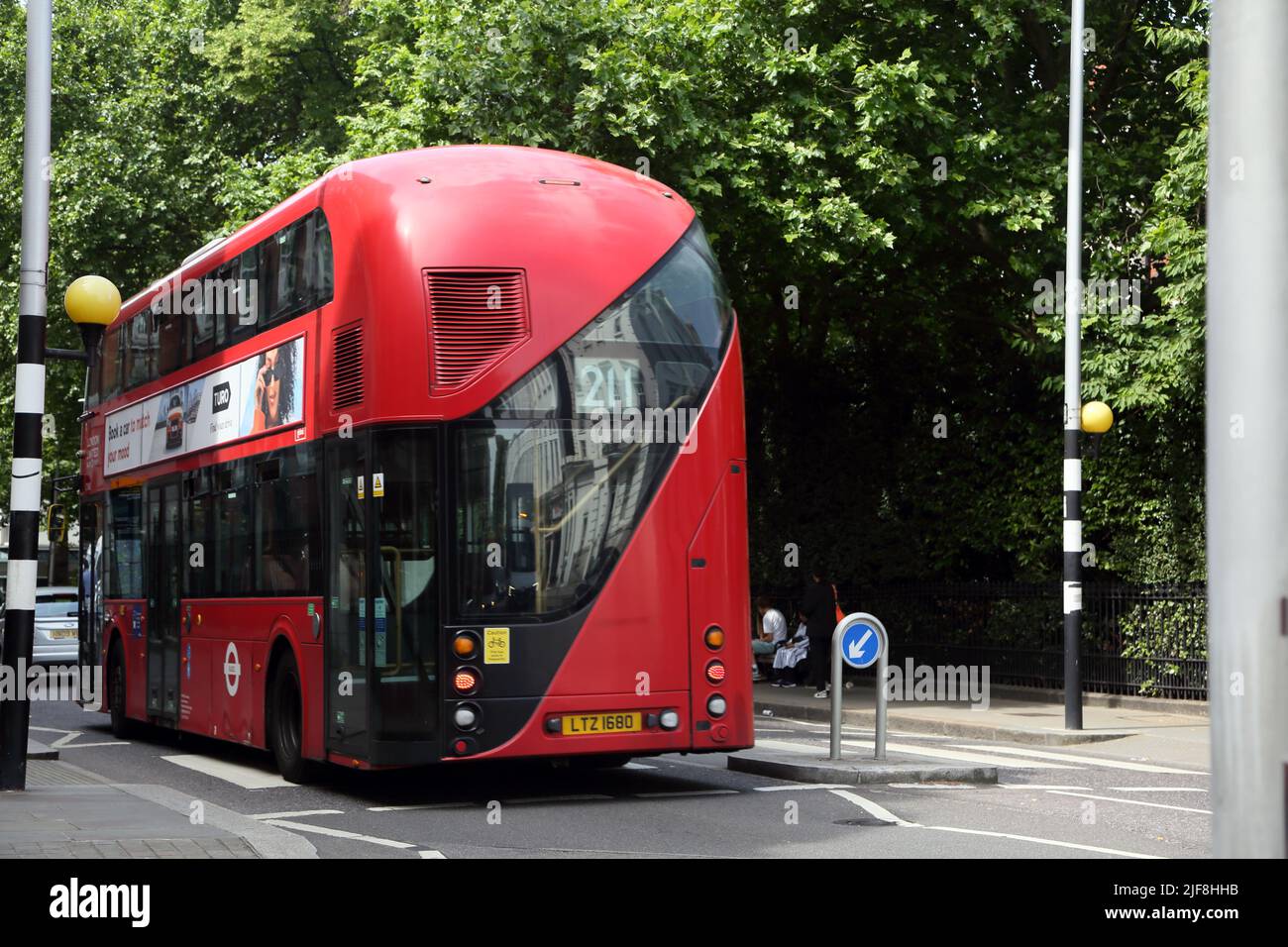 New  Routemaster Bus with Rear open Platform (Similar to Original) Driving Through Empty Pedestrian Crossing Fulham Road London England Stock Photo