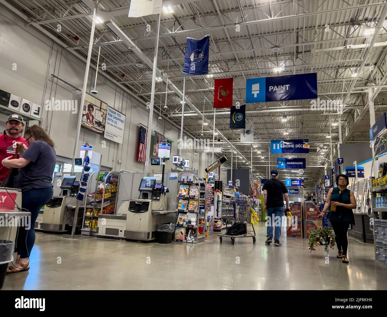Mill Creek, WA USA - circa June 2022: Angled view of people shopping inside a Lowe's home improvement store. Stock Photo