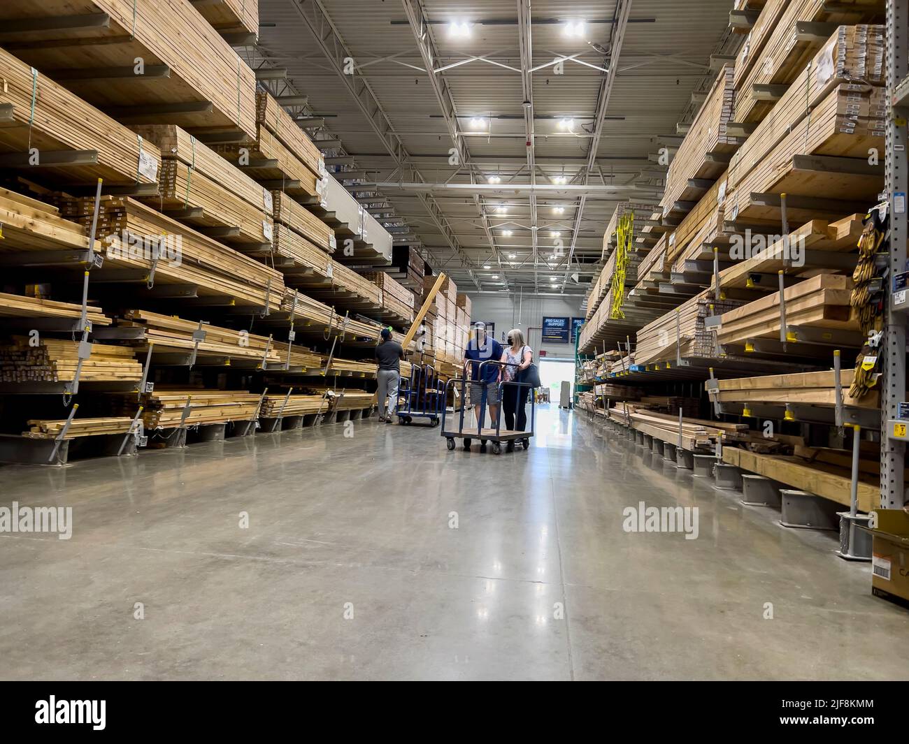 Mill Creek, WA USA - circa June 2022: View of a couple shopping for lumber inside a Lowe's home improvement store. Stock Photo